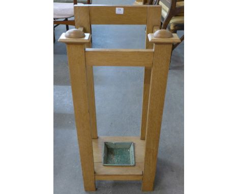 An Arts and Crafts oak stick stand