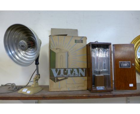A Pifco heat lamp and a ViTan ultra- violet lamp in case
