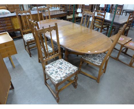 An Ercol extending dining table and six chairs