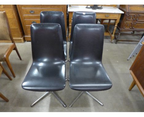 A set of four 1960's black vinyl and chrome chairs
