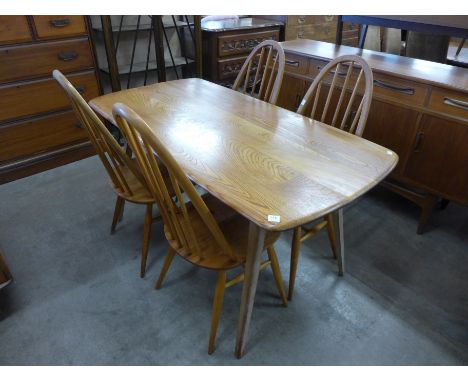 An Ercol table and four chairs