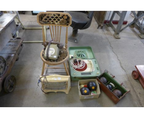 A record player, vintage phone, boxes, chairs, etc.
