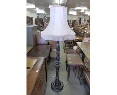 A mahogany effect standard lamp