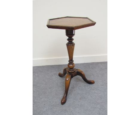 A Georgian style burr elm and walnut hexagonal top wine table with turned and vase shaped column on a tripod base