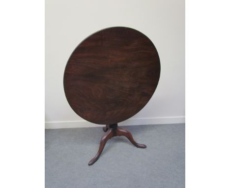 A Georgian mahogany tilt top table with tripod base 82cm diameter