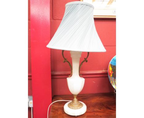 An alabaster and ormolu table lamp of classical form with white leather trimmed shade 