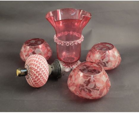 Three Victorian cranberry glass oil lamp shades with etched detail of flowers, leaf and vine oil sump and Victorian wavy form