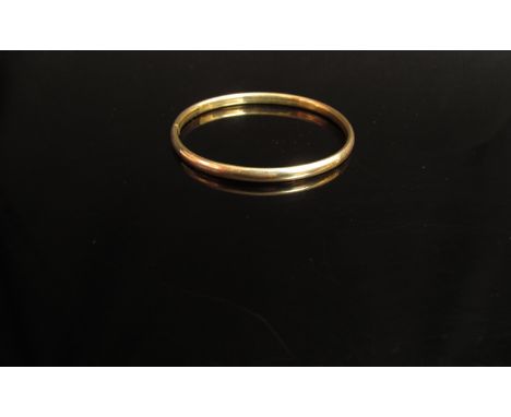 A 9ct gold bangle 