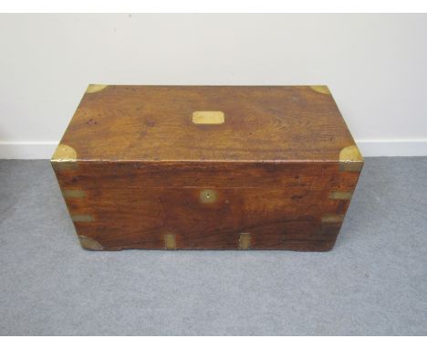 A mahogany trunk with brass inlay