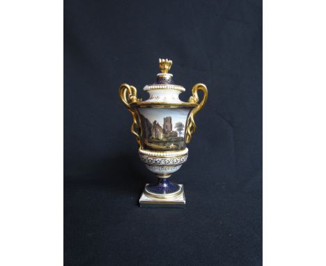 A Barr Flight and Barr Worcester two handled pedestal vase and lid, painted with 'Muckross' Abbey, Killarney highlighted in g