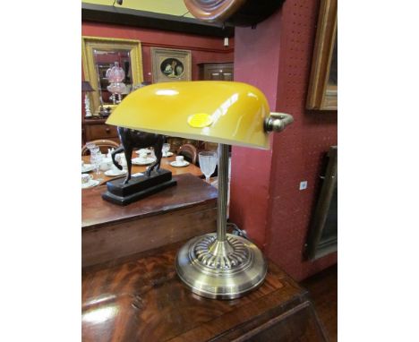 A bronzed bankers desk lamp with caramel glass shade 