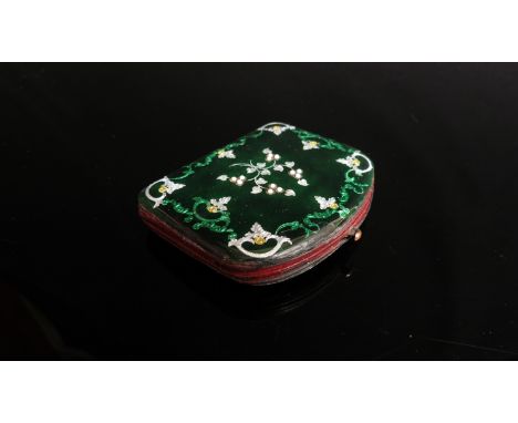 A 19th Century enamel and guilloche purse the dark green enamel with silvered, gilt and bright green scrolls and foliate deta