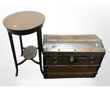 An early 20th century wooden bound trunk, width 68 cm and an inlaid mahogany oval table 