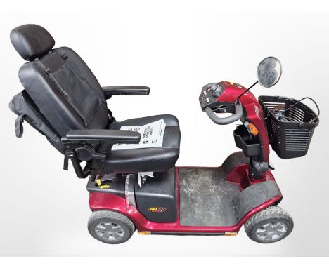 A Pride Mobility Scooter, with two keys, charging lead and owner's manual 