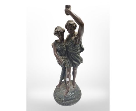 A resin figural lamp base, height 40cm, and a decorative gilt wall plaque.