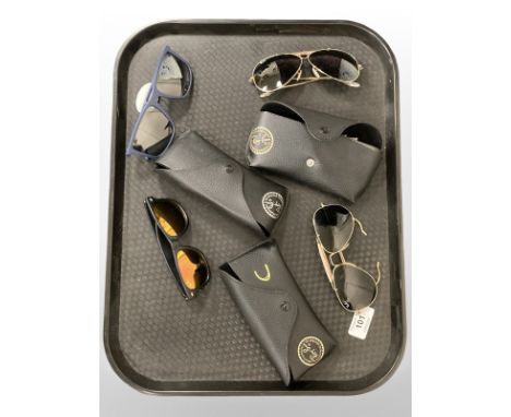 A group of sunglasses, to include, Emporio Armani and 3 pairs of Rayban.