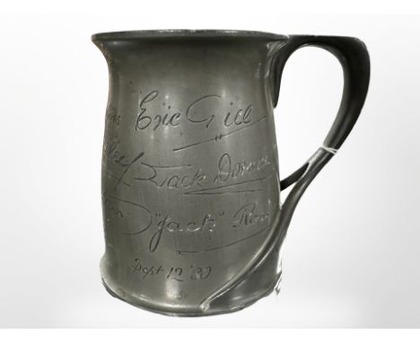 A Liberty & Co Tudric pewter tankard designed by Oliver Baker, with eleven etched autographs and dated 1930, height 11cm. 