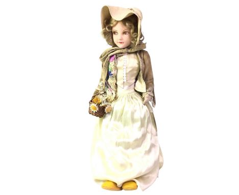 ATTRIBUTED TO CHAD VALLEY, FELT DOLL, EARLY TO MID-20TH CENTURY wearing bonnet, necklace, waistcoat with simulated mother of 
