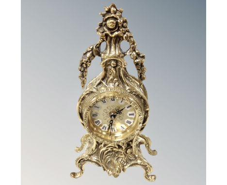 An ornate brass French style mantel clock 