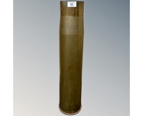 A heavy artillery brass ammunition shell casing, various engraved markings to base, diameter at base 14.5 cm, overall height 