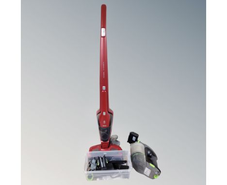 A G Tech hand held electric vacuum with charger and accessories together with a AEG animal CX7 stick vacuum with charging doc