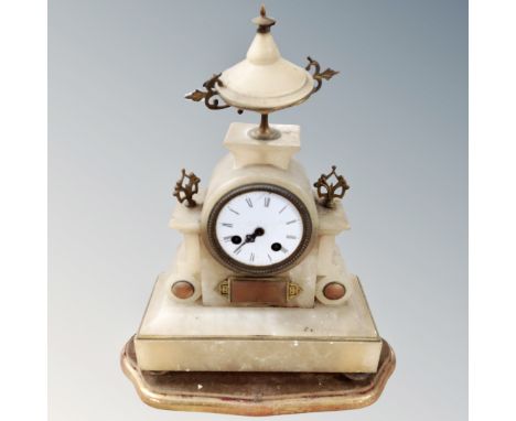 A Victorian gilt alabaster mantel clock on wooden stand 