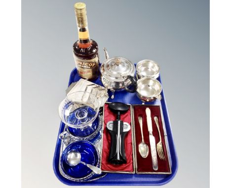 A tray of three piece silver plated tea service, cased cutlery, toast rack, Bols brandy, antique etched glass tazza etc 
