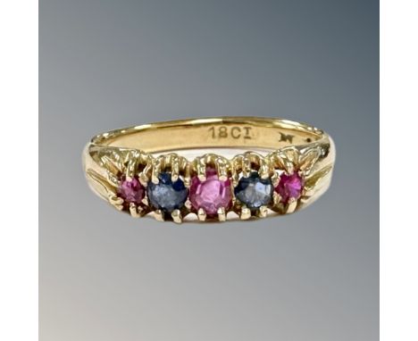 An 18ct gold sapphire and ruby half-eternity ring, size P CONDITION REPORT: 4.0g