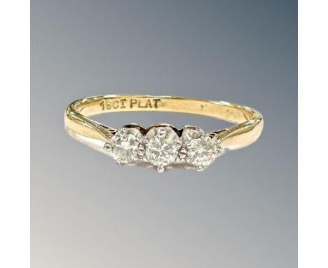 An 18ct gold and platinum three stone diamond ring, size Q CONDITION REPORT: 2.8g