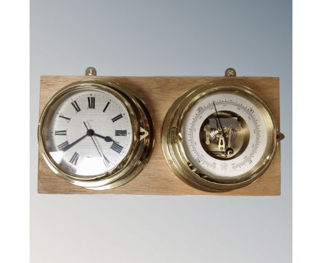 A two piece brass cased ship's style clock and barometer set, mounted on board 
