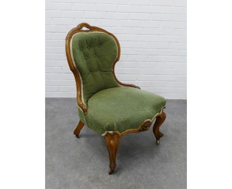 Victorian walnut chair with upholstered back and seat on cabriole legs terminating on ceramic castors 