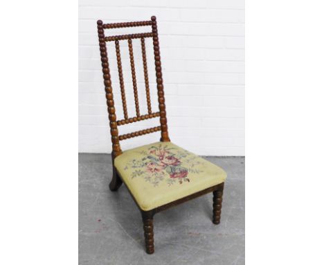 19th century bobbin spindle back chair, with bobbin turned front legs and floral upholstery, likely Scottish,  96 x 47cm 