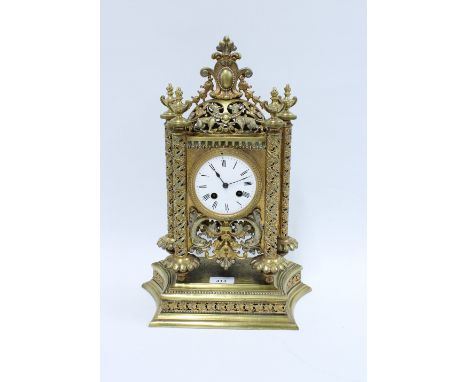 Gilt metal mantle clock, the enamel dial flanked by pierced pilasters, brass movement numbered 7791, 44cm 