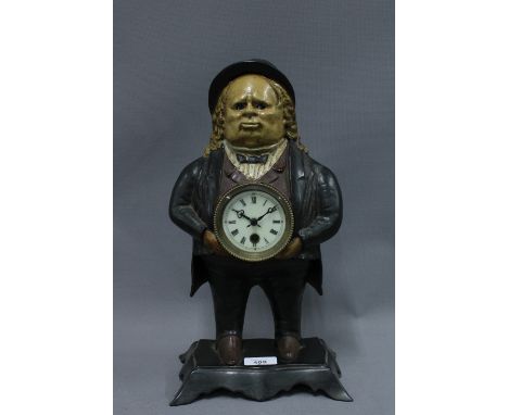 Figural spelter clock with moving eyes, 38cm 