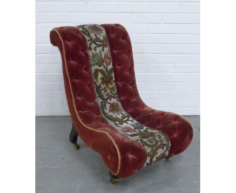 Victorian slipper chair, in buttoned red velvet and beaded fabric, ebonised legs with brass caps and ceramic castors, 78 x 50
