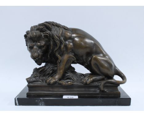 Lion and Boar bronze study, modern production on a black plinth base, 30 x 21cm 