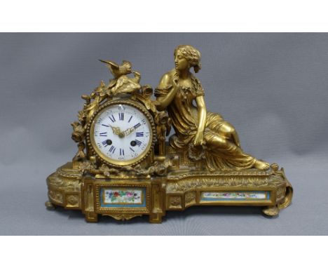 French mantle clock the ormolu case with classical female figure and birds, enamel dial with roman numerals, with Sevres styl