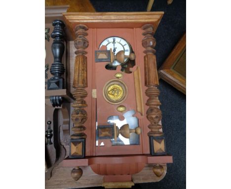 An early 20th century Junghans eight day wall clock in painted case 