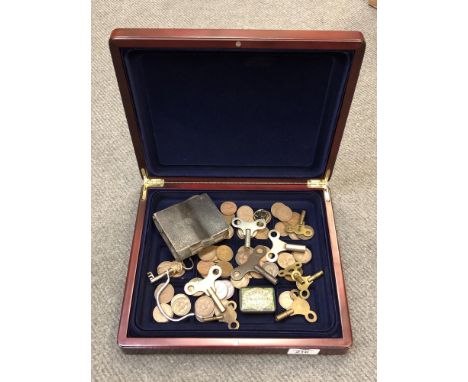 A quantity of coins, clock keys, antique French chocolate mould