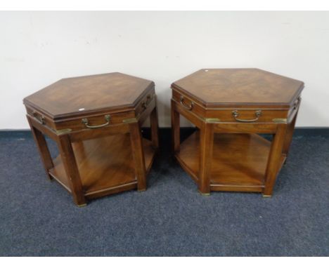 A pair of hexagonal two tier lamp tables with brass mounts 