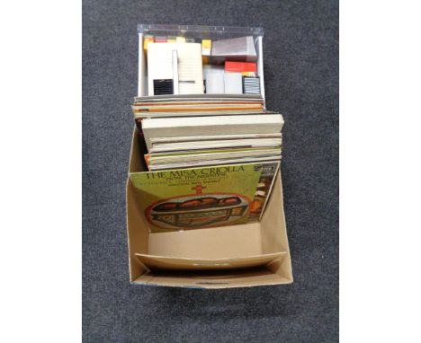 A box of lps, pictures, projector, slides etc 