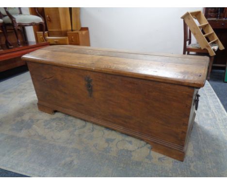 A 19th century oak domed topped shipping trunk, width 147 cm, height 58 cm and depth 65 cm.