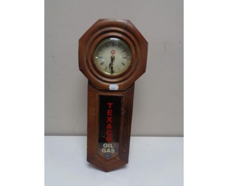 A mahogany cased eight day wall clock bearing Texaco Oil and Gas advertising 