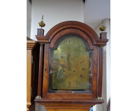 An antique oak and mahogany longcase clock by Burnett with pendulum and weights 