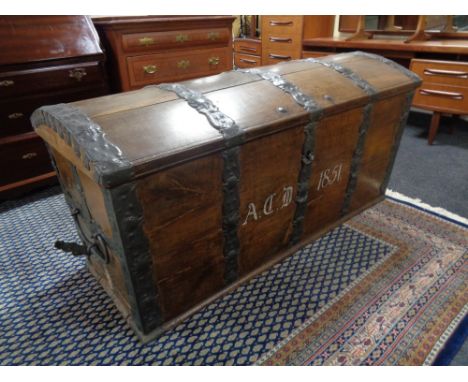 A 19th century oak and metal bound shipping trunk 