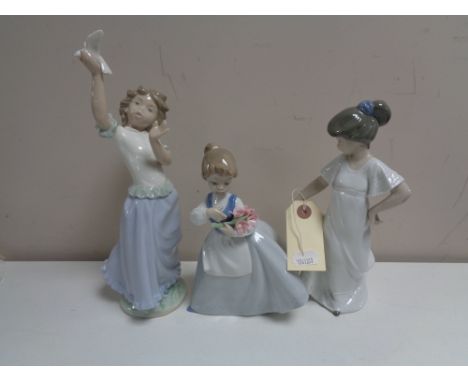 Three Nao figures - Girl with flowers no. 0495, girl in night dress  no. 1110 and girl with dove. (3)