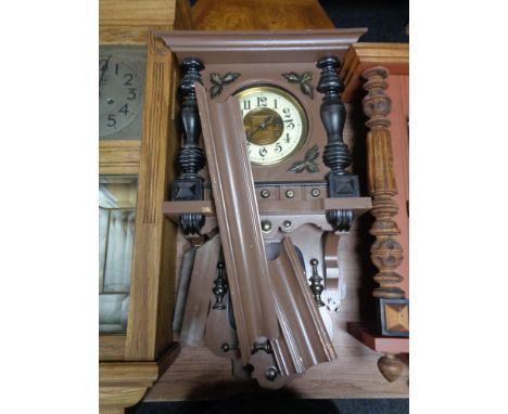 An early 20th century continental eight day wall clock with brass and enamelled dial in a painted case 