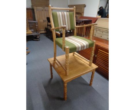 A blonde oak armchair and a lamp table 