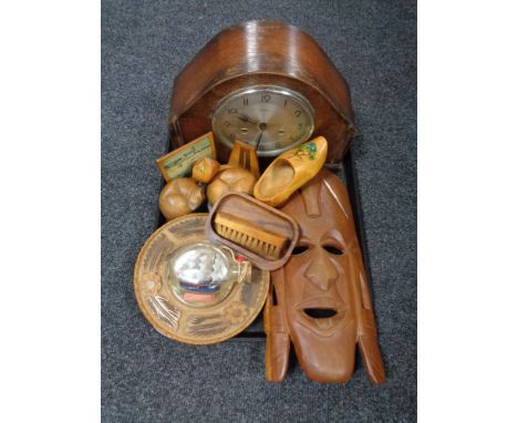 A tray of oak cased Bentima clock, wooden mask, cat ornament etc 