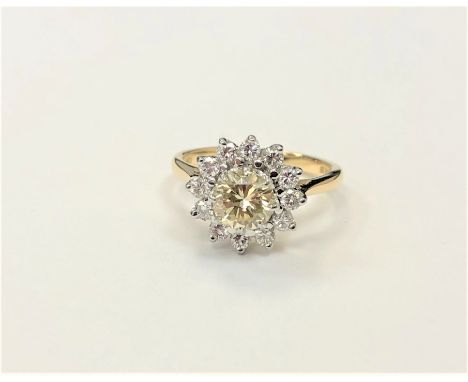 A fine quality 18ct gold diamond cluster ring, the principal fancy-yellow stone weighing approximately 0.90 carat, size N